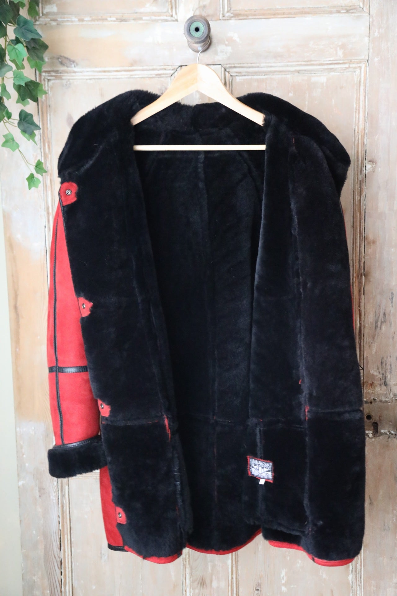 Vintage 1980s bright red and black sheepskin leather coat hood