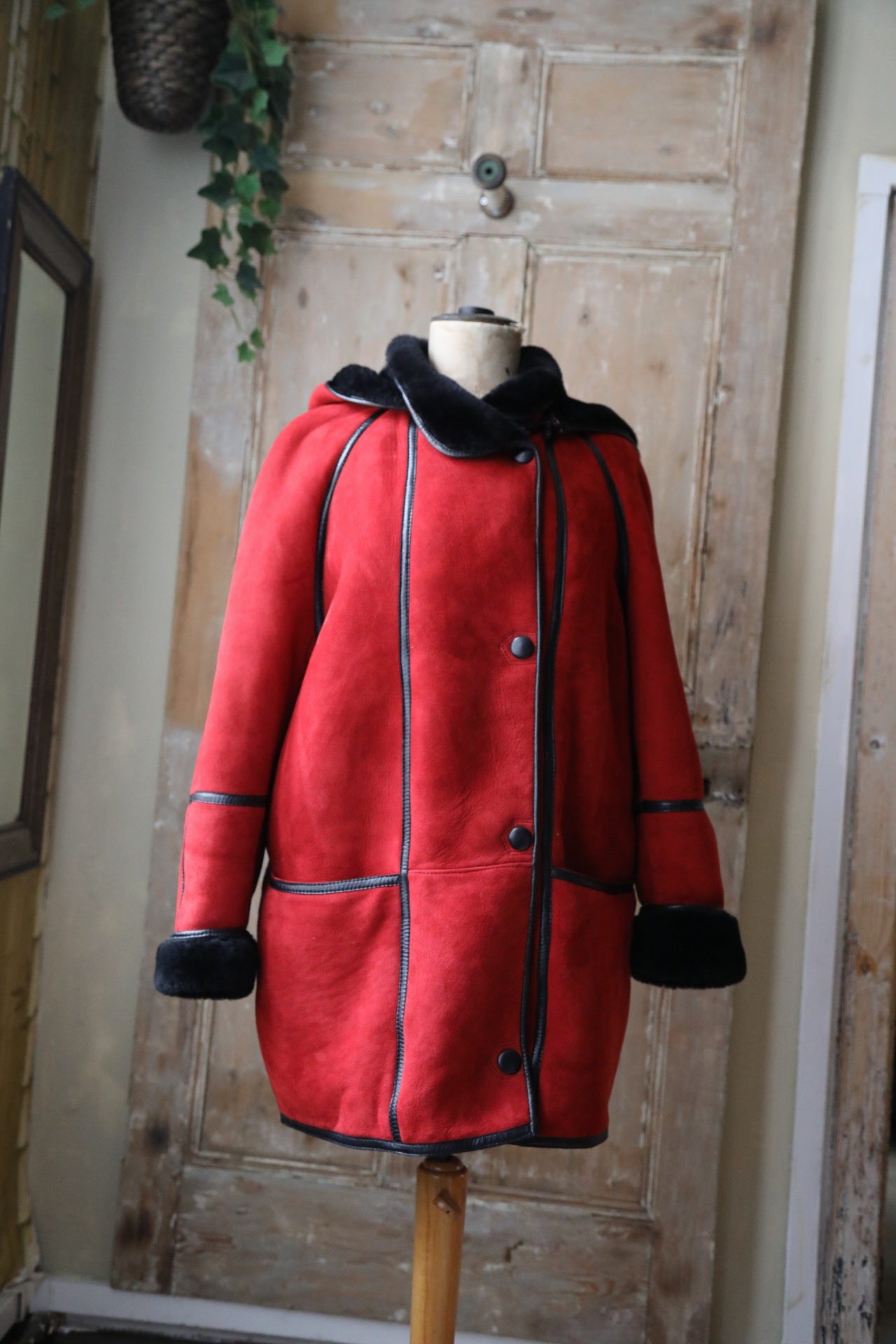 Vintage 1980s bright red and black sheepskin leather coat hood