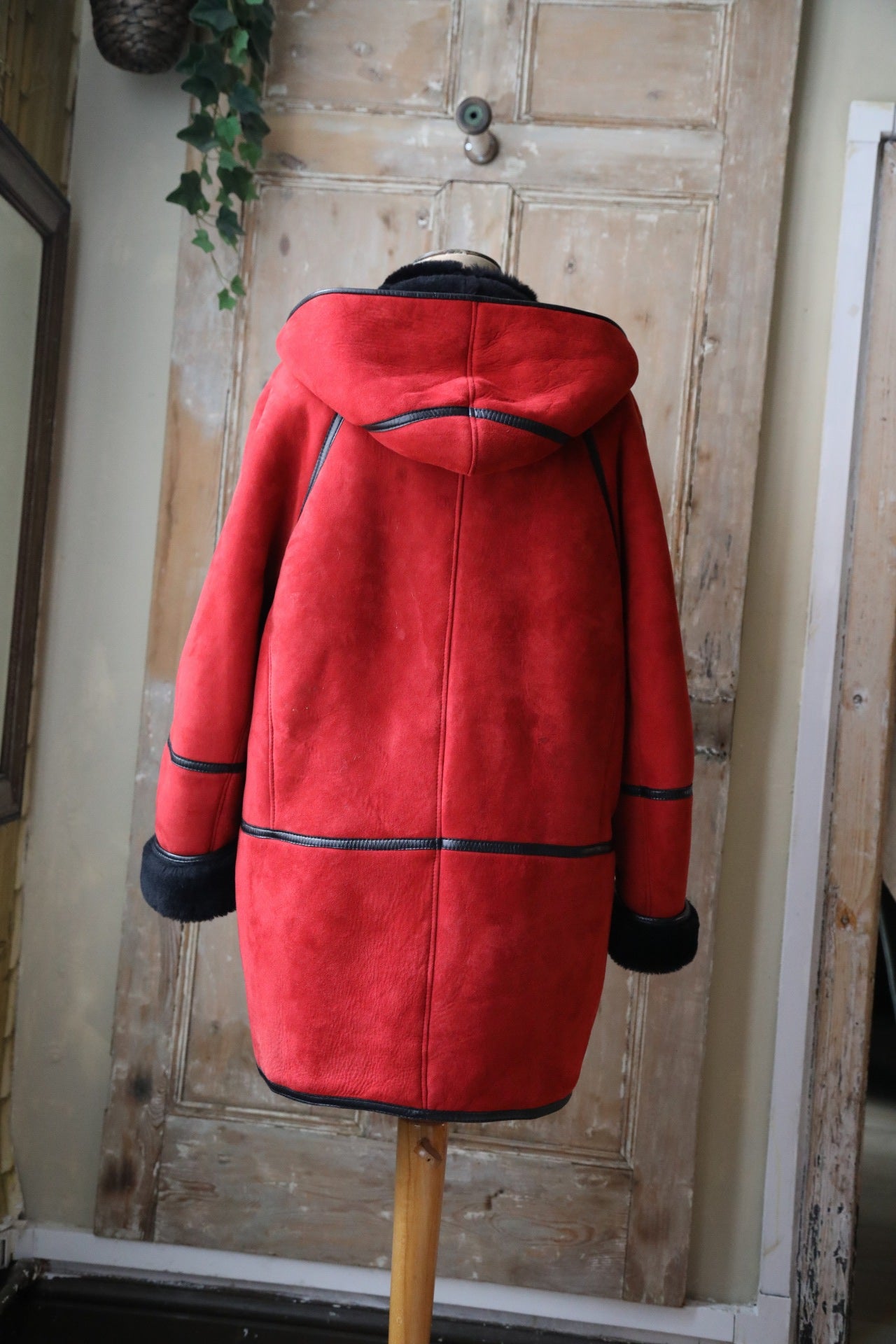 Vintage 1980s bright red and black sheepskin leather coat hood