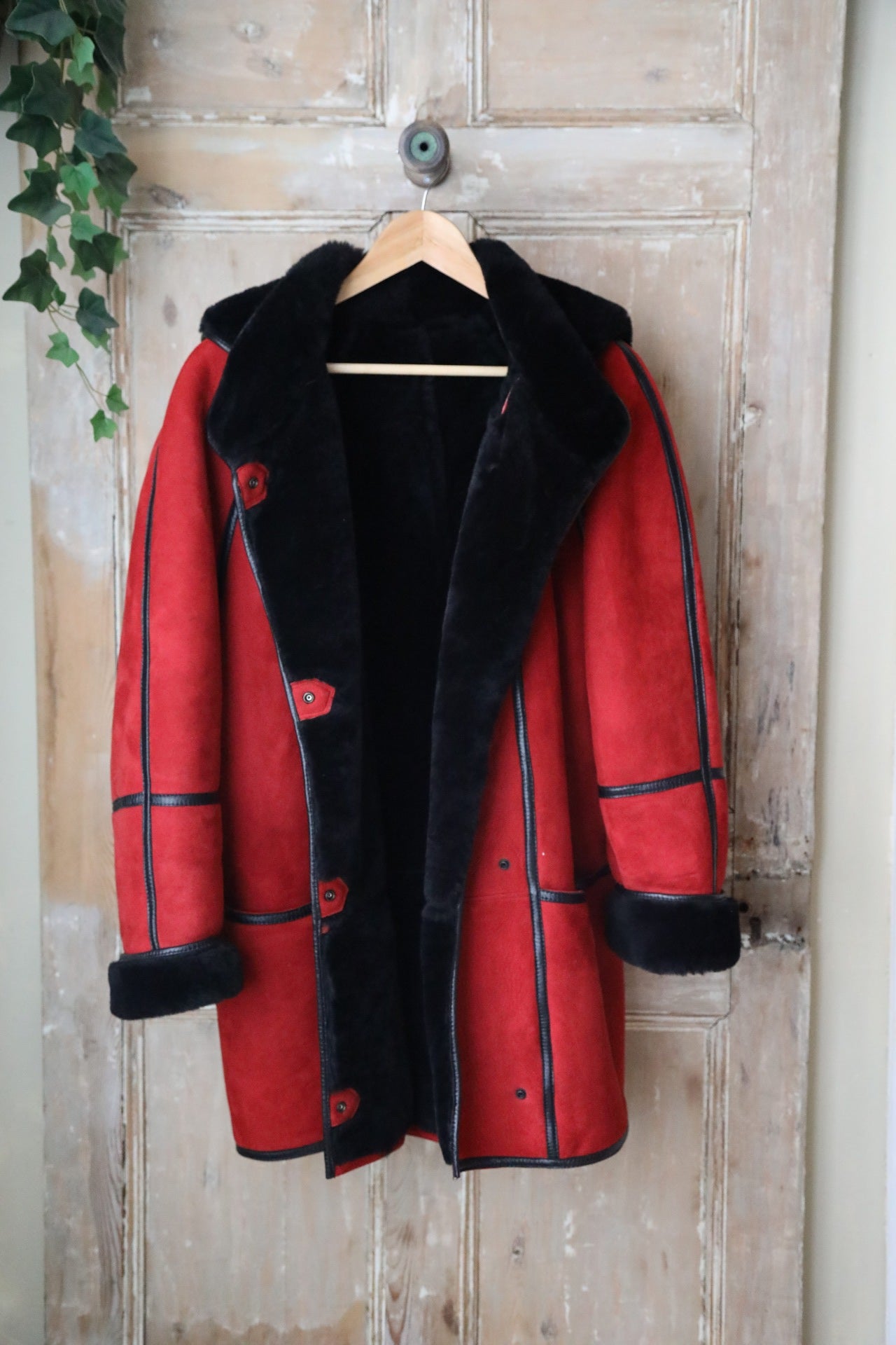 Vintage 1980s bright red and black sheepskin leather coat hood